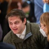 Man and woman chat at table